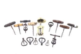 A collection of assorted corkscrews. Some with wood or bone handles.