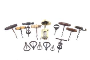 A collection of assorted corkscrews. Some with wood or bone handles.