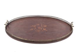An Edwardian mahogany tray. With pierced metal gallery and inlaid with a bouquet of flowers. L67cm.
