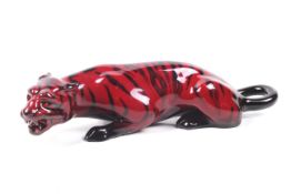 A Royal Doulton model of a tiger. In flambe glaze, L25.