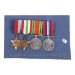 A set of four WWII medals. Two GRI VI Star medals (left example marked C 169402 C.J.