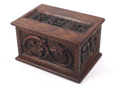 A Victorian wood box carved with the initials EH and date 1892 to the lid.