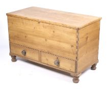 A Victorian stripped pine mule chest with knob handles and turned short legs. 76.5 cm H x 124.