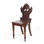 A Victorian mahogany stained oak hall chair.