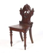 A Victorian mahogany stained oak hall chair.