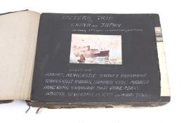 An early 20th century Japanese souvenir photograph album filled with photographs and postcards.