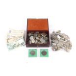 A box of world coins and a quantity of gaming tokens