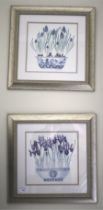 A pair of signed polychrome prints of Irises in silvered frames,