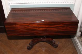 A Victorian mahogany pedestal breakfast table. Carved scroll feet, on a quadreform base, 70.