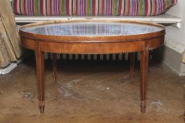 A late 18th century style oval mahogany coffee table.