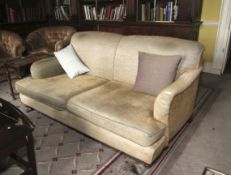 A 19th century style upholstered sofa in the Holland style. 83cm H, 175cm W, 95cm D.