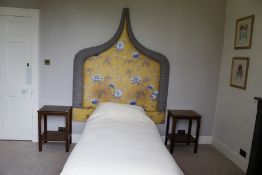 A shaped Oriental silk upholstered headboard, 188cm H, 160cm W, with flowers,