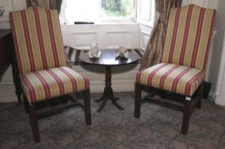A pair of contemporary George II style upholstered dining chairs.