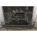 A Regency cut steel fire fender.