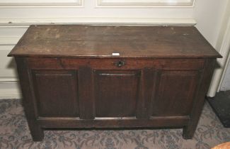 An 18th century oak three panel coffer. With panelled sides, 72 cm H x 128.5 cm W x 50.5 cm D.