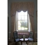 A pair of damask silk lined curtains and matching tasselled pelmet.