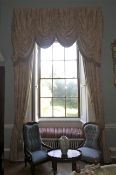 A pair of damask silk lined curtains and matching tasselled pelmet.