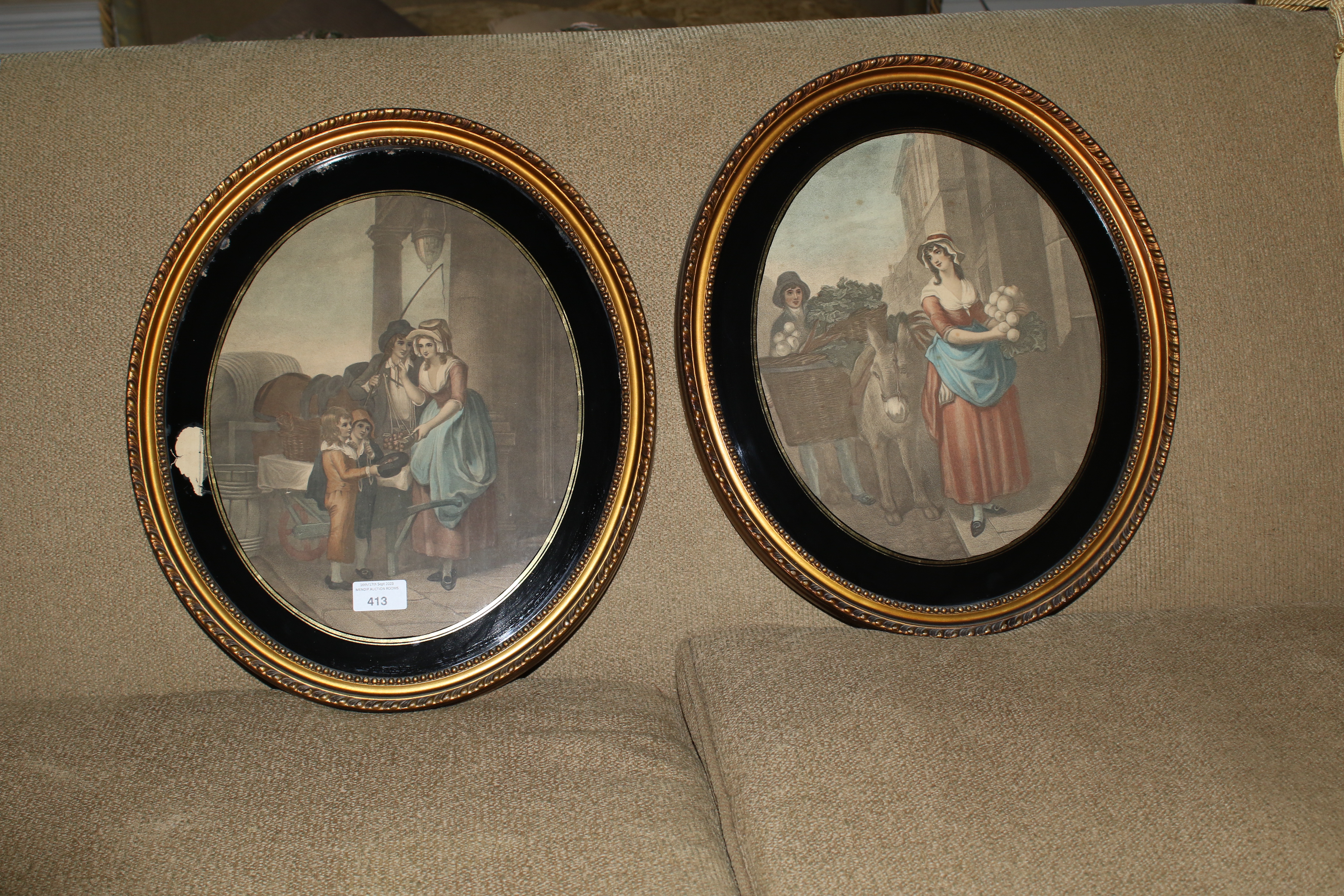 A pair of early 19th century verre eglomise oval coloured mezzotints, probably Cries of London,