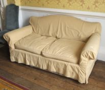 An early 20th century hump backed 2 ½ seat sofa. 80cm H, 160cm W, 80cm D.