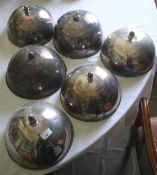 A collection of silver plate meat covers, mostly with turned knopped finials. 20cm H.