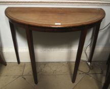 A late 19th century mahogany demi-lune side table.