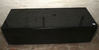 A large black modern TV cabinet with three doors opening to shelves, 50cm H, 155cm W,