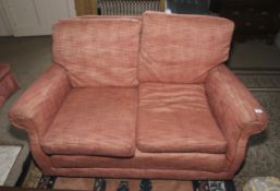 An Edwardian style feather squab two seat sofa.
