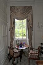 A pair of damask silk lined curtains and matching tasselled pelmet.