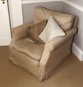 A contemporary Victorian style buff upholstered armchair.