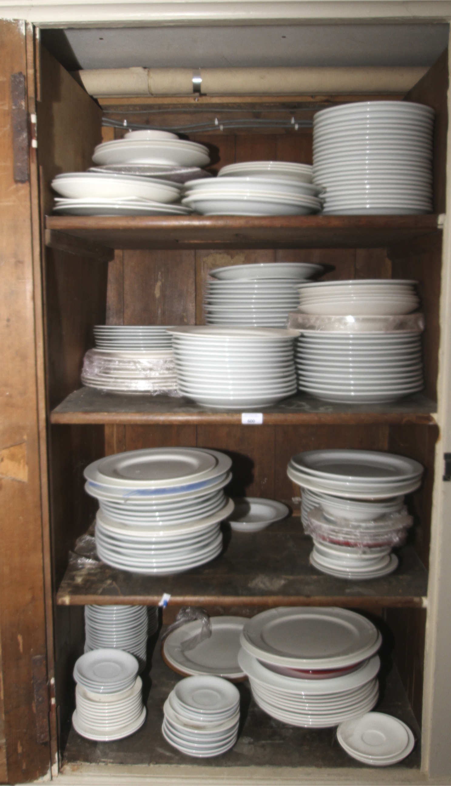 A large assortment of plates, dessert plates, side plates,