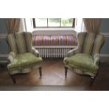 A pair of contemporary upholstered armchairs.