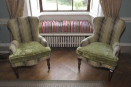 A pair of contemporary upholstered armchairs.