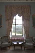 A pair of damask silk lined curtains and matching tasselled pelmet.