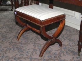 A contemporary X-frame piano mahogany stool.