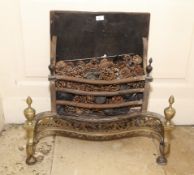A Regency style cast iron and pierced brass serpentine shaped fire basket. 69cm H, 70cm W, 35cm D.