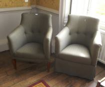 A pair of 20th century upholstered tub chairs.