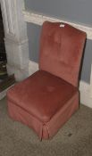A 20th century upholstered sprung seated salmon upholstered nursing chair, 80cm H, 45cm W,