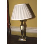 A brass and mirrored glass 20th century table lamp with pleated silk shade. 60cm H.