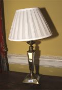 A brass and mirrored glass 20th century table lamp with pleated silk shade. 60cm H.