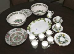 A collection of assorted foliate inspired and mostly hand painted ceramics.