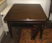 A late 19th century mahogany wind out extending dining table.