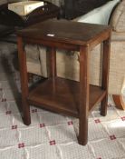 A 20th century mahogany two tier occasional table. 66cm H, 42cm W.