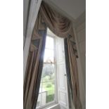 A pair of damask silk lined curtains and matching tasselled pelmet.