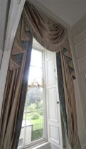 A pair of damask silk lined curtains and matching tasselled pelmet.