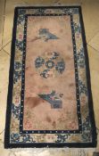 Two Chinese rugs. With beige and blue colours, one 140cm x 70cm, the other 155cm x 90cm.