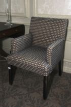 An early 20th century style upholstered armchair. Square tapering legs, 90cm H, 59cm W, 56cm D.