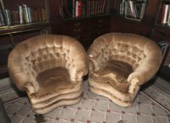 A pair of 1930s Victorian style armchairs. With feather squab cushions, 79cm H, 97cm W, 82cm D.