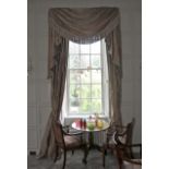 A pair of damask silk lined curtains and matching tasselled pelmet.