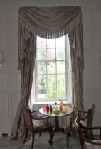 A pair of damask silk lined curtains and matching tasselled pelmet.