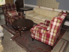 A pair of 20th century tartan upholstered wing back armchairs.